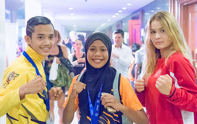 Young Muay Thai fighters pose before the IFMA youth conference. Photo: UN Women/Younghwa Choi 
